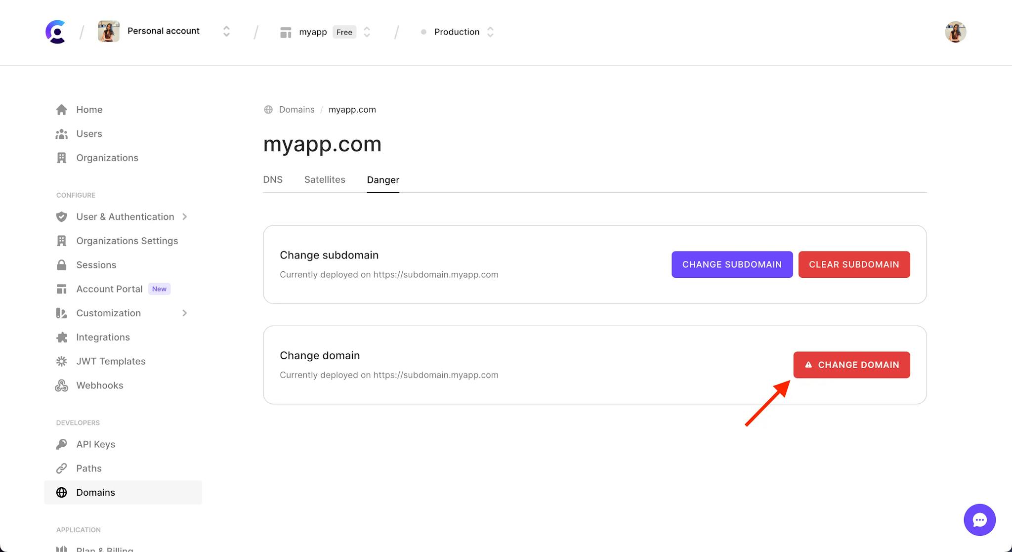 The 'Danger' tab of the Domains page in the Clerk Dashboard.There is a red arrow pointing to the 'Change domain' button.